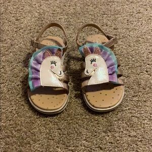 Sandals with unicorn detail.